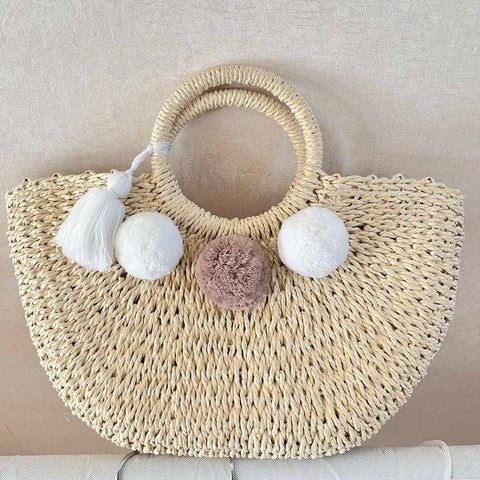 STRAW BASKET BAG WITH POM POMS